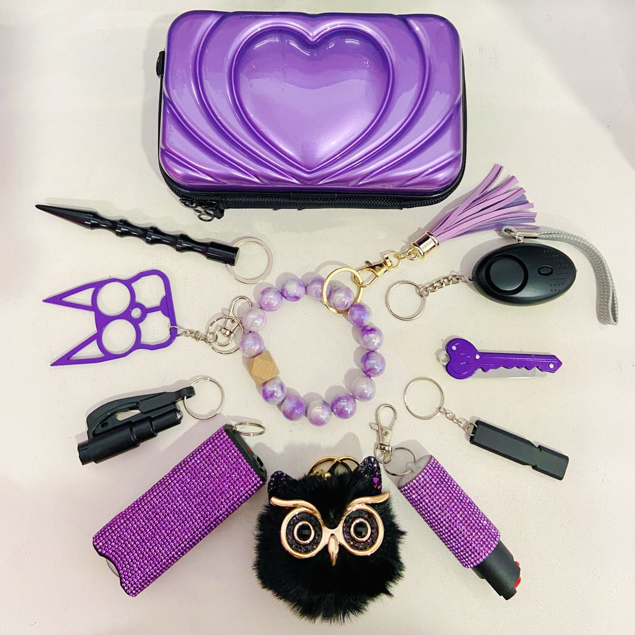 10 PCS Self Defense Keychain Set- Purple And Black Set - Premium self defense keychain set for women's personal safety. Features 10-piece comprehensive set and Tactical grade materials.
