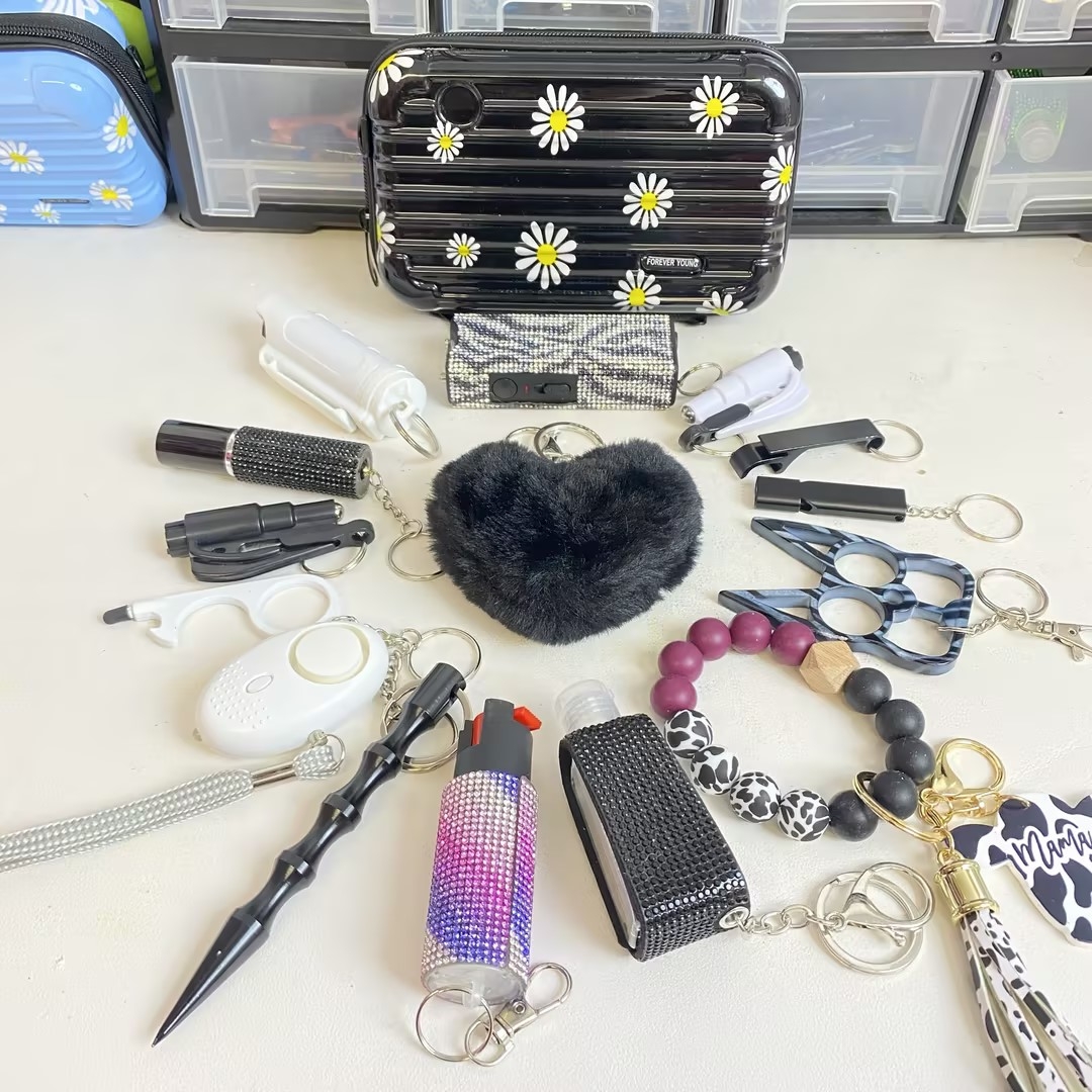 16-Piece Black Suitcase Keychain Set - Premium self defense keychain set for women's personal safety. Features Tactical grade materials and Discrete design.