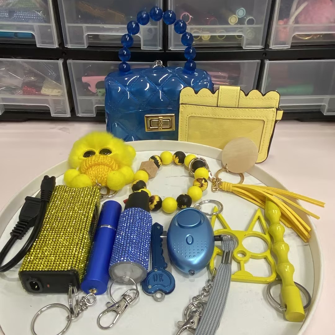 New Arrivals 11pcs Blue And Yellow Keychain - Premium self defense keychain set for women's personal safety. Features 11-piece comprehensive set and Keychain attachment.
