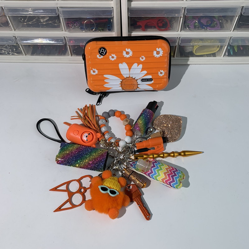 Orange Shiny Lightning Keychain 13pcs Keychain Set - Premium self defense keychain set for women's personal safety. Features 13-piece comprehensive set and Multiple defense tools.